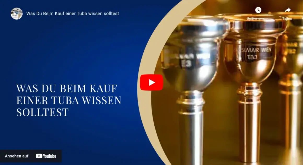 Nahaufnahme von Mundstücken eines Blechblasinstruments, einer Tuba. Der Text "Was Du Beim Kauf einer Tuba wissen solltest" ist sichtbar.