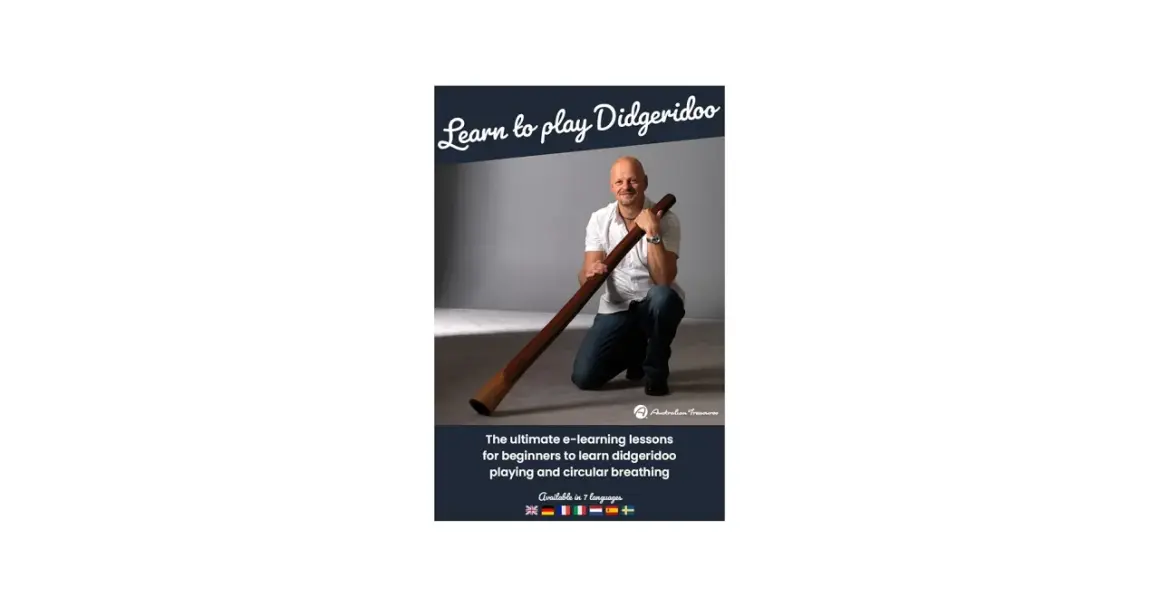 Mann kniet mit einem Didgeridoo, bereit, es zu spielen. Online-Kurse für Anfänger.