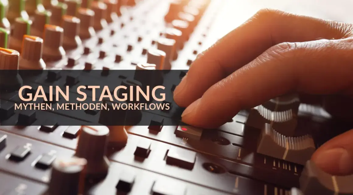 Hand bedient Mischpult-Regler. Die Bedeutung von Gain Staging für Mythen, Methoden und Workflows wird hier visuell dargestellt.